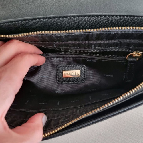 Carpisa black crossbody bag used with magnetic clasp