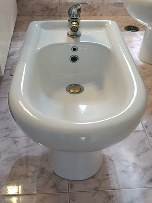 Porcelain bathroom bidet like new with faucet