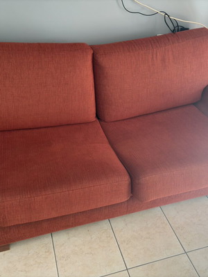 Orange sofa like new, comfortable and soft