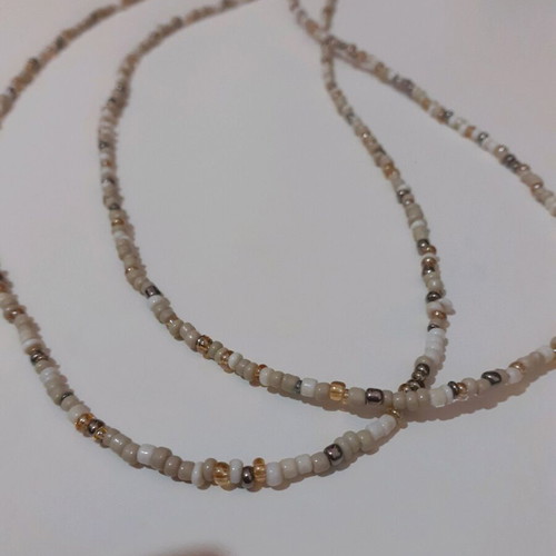 Long beaded necklace new in white and gold shades with tassel