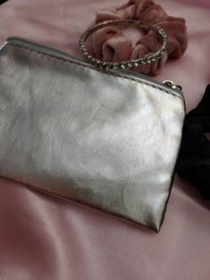 Small leather wallet for coins and cards in silver color