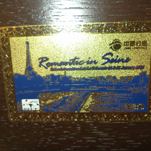 Metallic phone card used, empty, 11 g