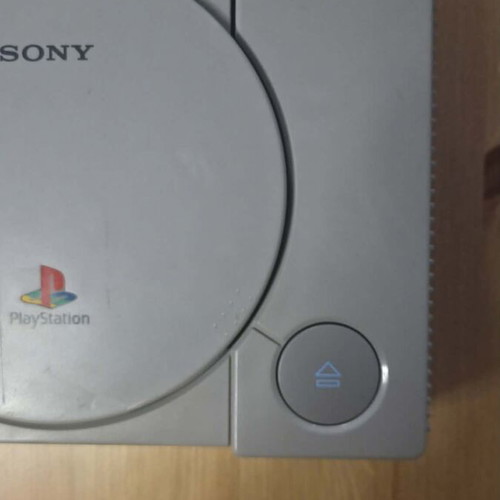 Sony PlayStation 1 console used with memory card, controller, and game