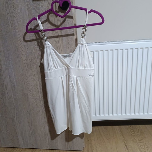 White sleeveless top with silver details
