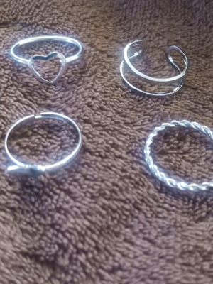 Set of 4 silver rings, different designs, size 3