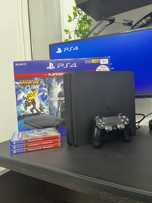 PlayStation 4 Slim 1TB console used with 3 games and Dualshock 4
