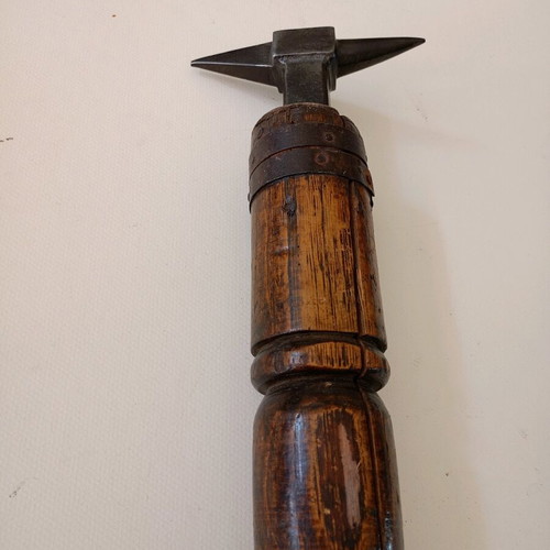 Anvil used for goldsmith or watchmaker with wooden base