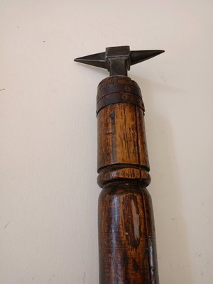 Anvil used for goldsmith or watchmaker with wooden base