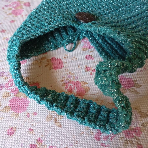 Handmade knitted handbag in turquoise green