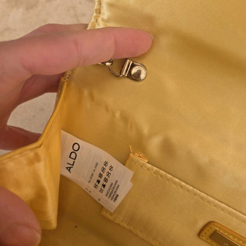 Aldo yellow vinyl clutch bag used with gold trim