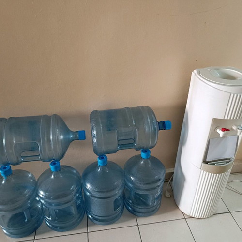 Water cooler used with 6 bottles for cold and hot water