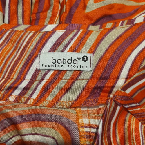 Batida skirt used with color blocking in purple, orange, beige, white