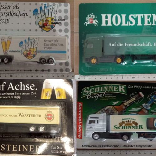Set of 4 H0 scale beer advertising trucks