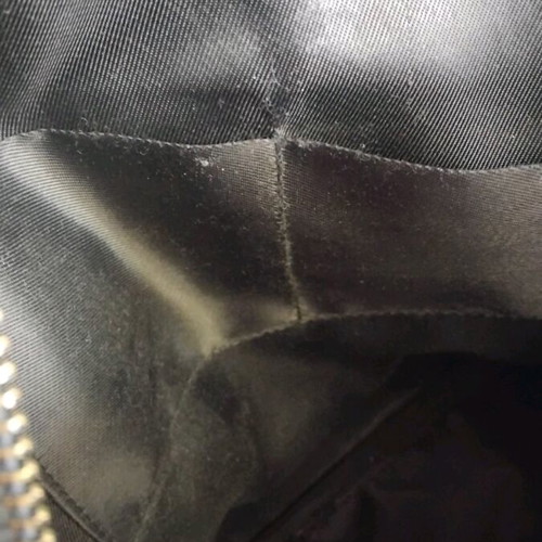 Snakeprint backpack used, grey with snake pattern and studs