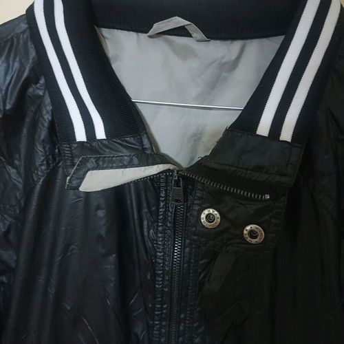 Black vinyl jacket used with white stripes, size L Pull & Bear