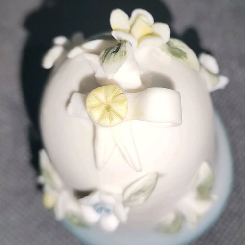 Ceramic bell used with embossed flower designs