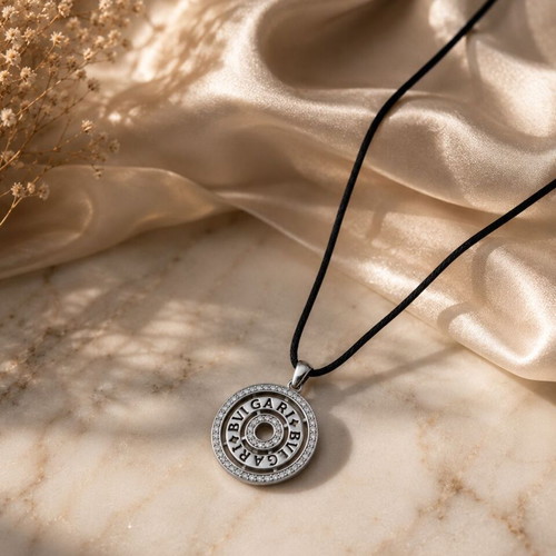 Bvlgari necklace with leather cord gray like new