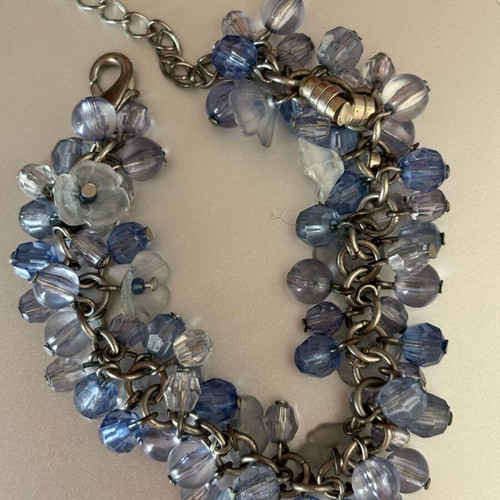 Bracelet with flowers in blue purple color, new
