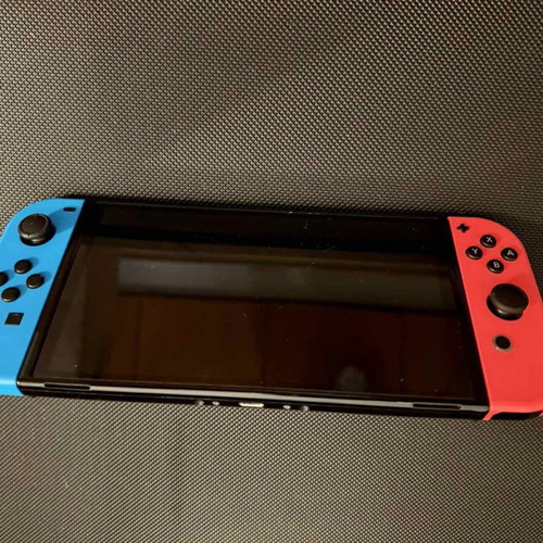 Nintendo Switch OLED used with carrying case and 256GB memory card