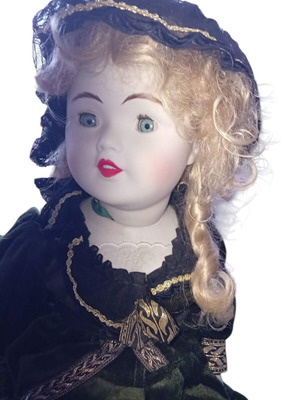 Porcelain doll used with dark green velvet dress and matching hat