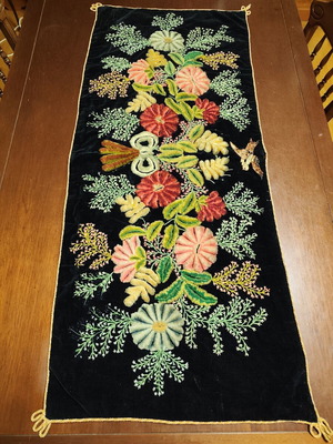 Wall hanging antique made of black velvet with colorful embroidery used