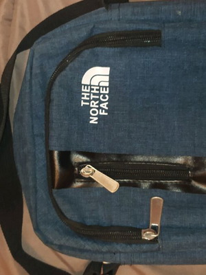 The North Face crossbody bag new, black and blue