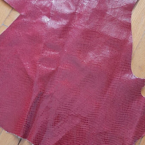 Leather with snake-like finish, slightly glossy, new