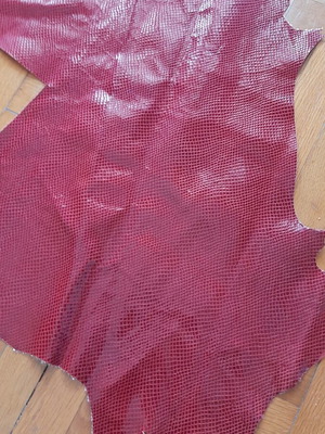 Leather with snake-like finish, slightly glossy, new
