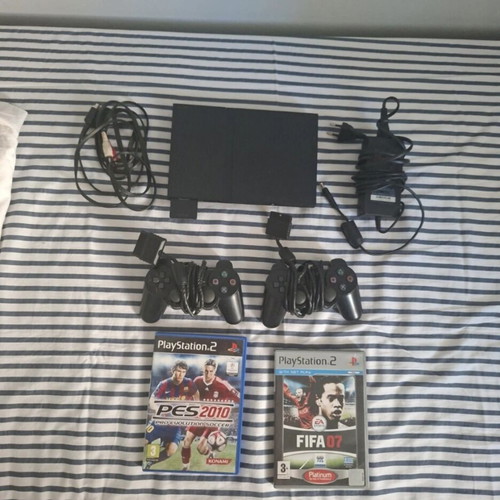 PlayStation 2 Slim console like new with 2 controllers, 2 games, and memory card