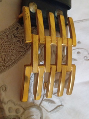 Vintage leather belt with impressive gold buckle used