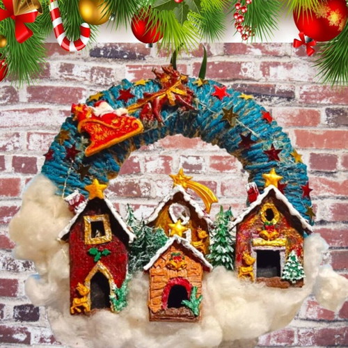 Handmade wreath Santa Claus with sleigh in Christmas village lit with LED