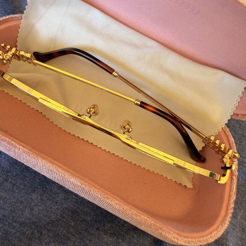Miu Miu SMU 54ZS ZVN-70D sunglasses like new, gold frame, pink lenses