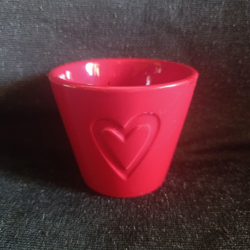 Ceramic pot with embossed heart like new, red color