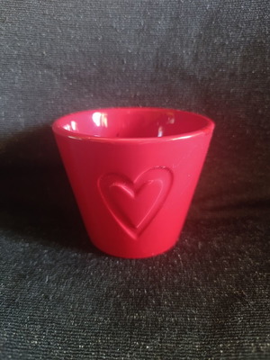 Ceramic pot with embossed heart like new, red color
