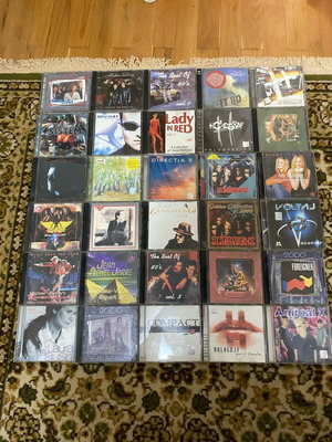 Various used pop CDs