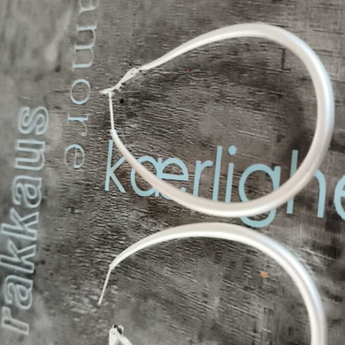 Modern earrings like new, silver color