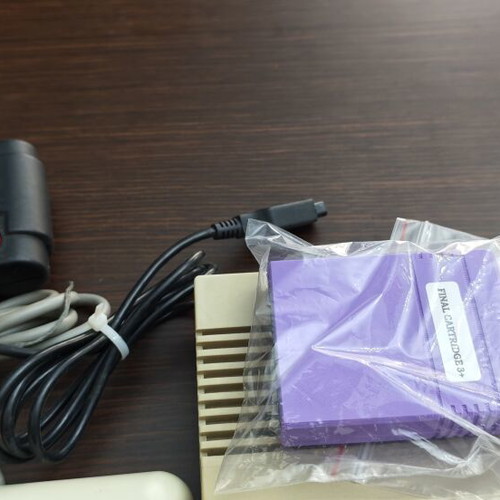 Commodore C64c personal computer with joystick and accessories
