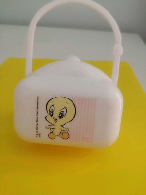 Plastic pacifier case used with Tweety design
