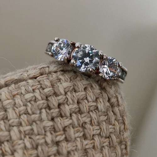 Trilogy silver plated ring used with zircon and heart motifs