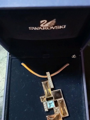 Swarovski necklace like new with leather cord multicolor