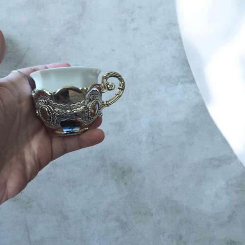 Porcelain coffee cups with silver bases like new