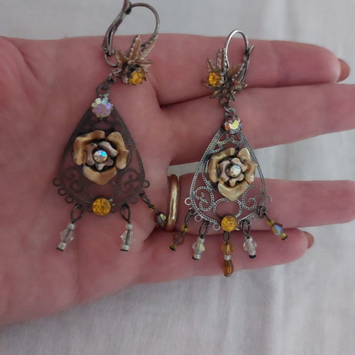 Earrings used with stones, missing 2 rows on one