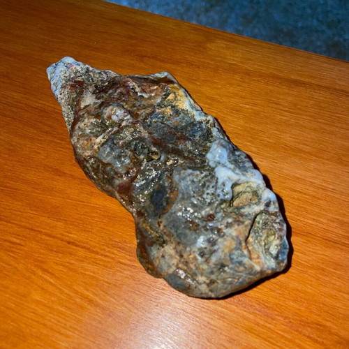 Natural rock with quartz and iron oxides