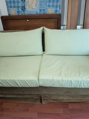 Two-seater sofa bed used