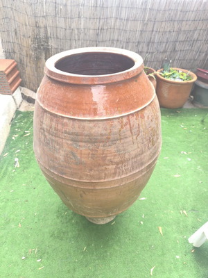 Large traditional terracotta jar used for outdoor decoration