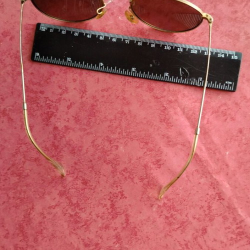 Round sunglasses with green mirrored lenses used, gold frame