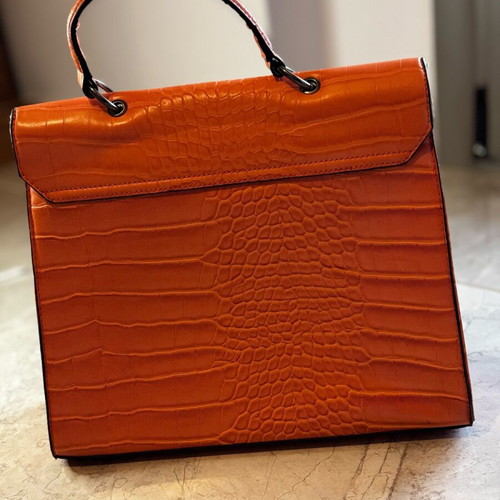 Orange shoulder bag like new made of sturdy material