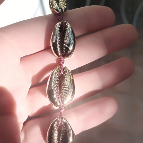 Handmade bracelet with gold metal shells and adjustable polyester cord