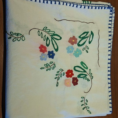 Vintage handmade embroidered tablecloth with flowers and needlework