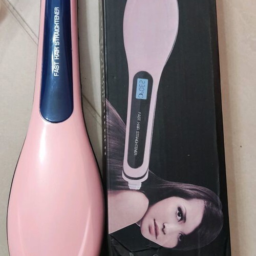 Heated hair brush for straightening and styling like new